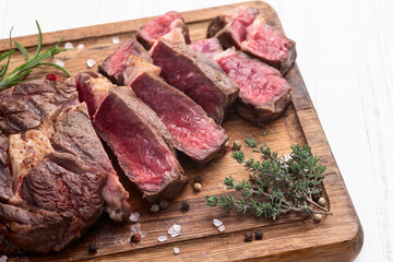 Ribeye grilled  beef steak sliced . Rare doneness photography . Top view