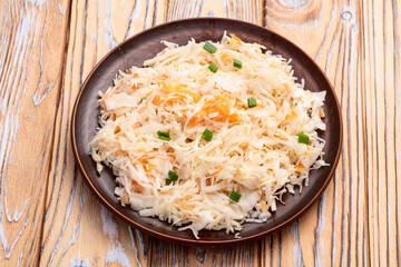 Tasty marinated cabbage with carrot, healthy food  Sauerkraut photography . Top view