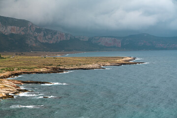 Stunning Coastal Landscape of Sicily, Italy Under Dramatic Clouds