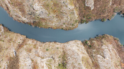 Aerial shot of Matka Canyon in North Macedonia. Flying over long green canyon Matka. 