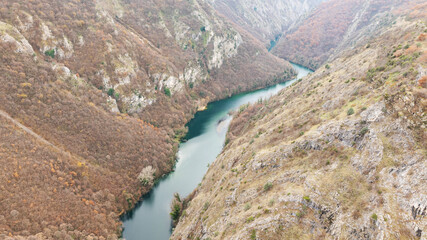 Aerial shot of Matka Canyon in North Macedonia. Flying over long green canyon Matka. 