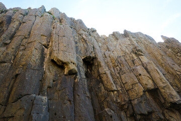 Landscape A close-up view of the dramatic columnar jointing of the Tojinbo Cliffs, showcasing the...