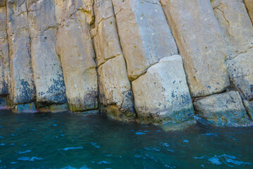 Landscape A close-up view of the dramatic columnar jointing of the Tojinbo Cliffs, showcasing the...