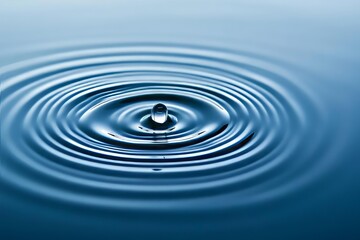 Black and white minimalist art of raindrops creating ripples in water for a simple aesthetic