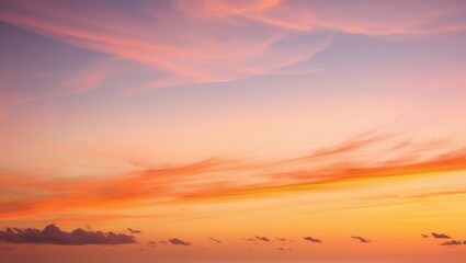 Obraz premium The beauty of luxurious soft gradient clouds in shades of orange and gold, bathed in sunlight against a blue sky, creates the perfect backdrop for an evening twilight scene.