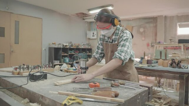 Explore the intricate world of woodworking in this vibrant workshop. Witness a skilled artisan shaping wood with precision tools while surrounded by a creative atmosphere filled with projects in progr