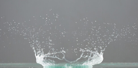 Crown Water splash on object to create shape form fluttering in droplet and wave. Crown water to...
