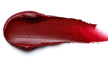 Scarlet lipstick smear showing texture and sheen on white background. Ideal for cosmetics displays.