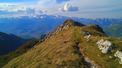 Obraz premium Breathtaking Mountain Landscape Along Pathway to Summit with Scenic Views and Majestic Peaks in Background
