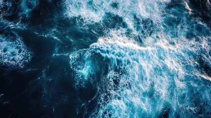 Aerial perspective of deep blue ocean waves creating a dynamic textured background ideal for text and graphic overlay applications