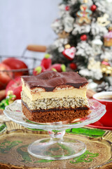 Multi layer cake with vanilla, poppy seed and chocolate.