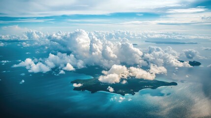Naklejka premium Aerial View of Lush Tropical Island Surrounded by Turquoise Waters and Fluffy White Clouds Under a Bright Sky