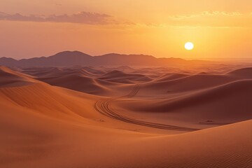 Sunset over vast, orange sand dunes with tire tracks. Perfect for travel, adventure, or desert landscape themes.