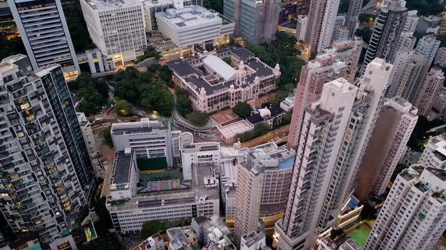 Hong Kong: Aerial drone footage of the historic Hong Kong university building in the very crowded Sai Wan district in Hong Kong island. 