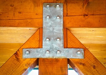 iron sheet connects wooden beams