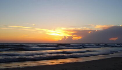 Sunrise over ocean beach.  Peaceful morning light.  Possible use Stock photo for travel, relaxation, or nature