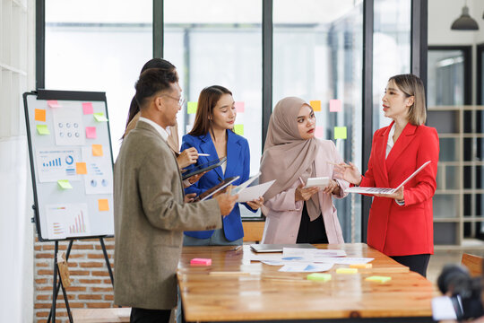 Business asian people, happy and celebration for success in office with company investment and stock market bonus. Teamwork, employees and support or trading achievement excited in boardroom.
