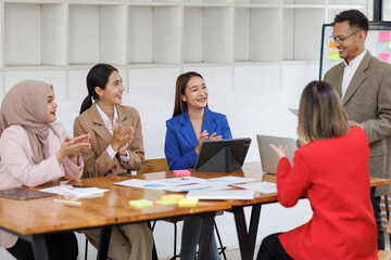 Business asian people, happy and celebration for success in office with company investment and stock market bonus. Teamwork, employees and support or trading achievement excited in boardroom.