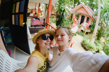 Selfie mom and daughter portraits in Asia in Thailand