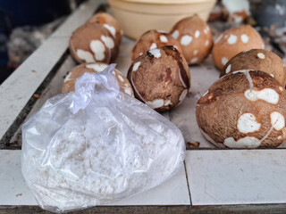 plastic bag containing shredded coconut. coconut milk making process