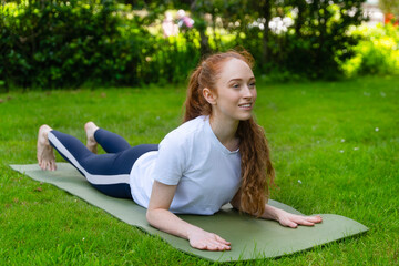 Outdoor yoga practice in a serene garden setting during a sunny day