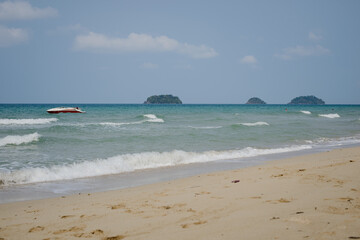 Portrait of a little girl in Asia in Thailand against the background of the sea