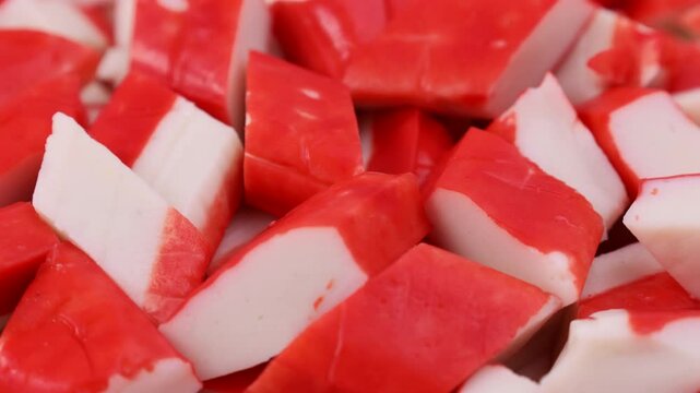 Red crab sticks or surimi circle rotation close up