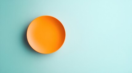 A bright orange circle against a pale blue background, evoking a sunny, cheerful vibe.