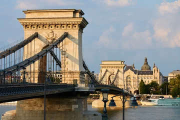 Szechenyi Chain bridge in Budapest at Sunset. Famous bridge over Danube river connecting Buda and Pest. Historical architecture in Hungary