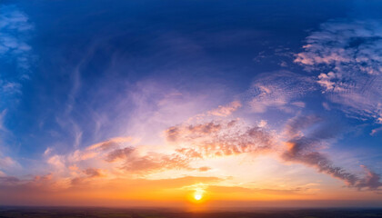 Fototapeta premium amazing real sky gentle colors panoramic sunrise sundown sanset sky with colorful clouds without any birds large panoramic sky with sun cloudscape