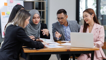 Happy asian business woman executive ceo leader discussing project management planning strategy working with diverse colleagues company team at office corporate board group meeting.
