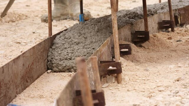 Concrete pouring process in construction site for foundation work