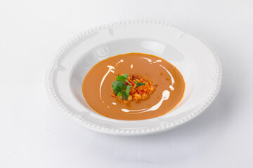 Fine cuisine on a white plate on a white background. Author's cuisine