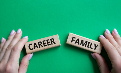 Family or Career symbol. Concept word Family or Career on wooden blocks. Businessman hand. Beautiful green background. Business and Family or Career concept. Copy space