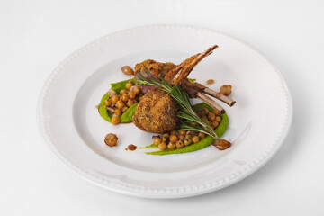Fine cuisine on a white plate isolated on a white background. Author's cuisine