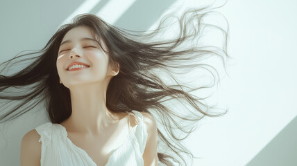 Fototapeta premium 白い背景で微笑む女性