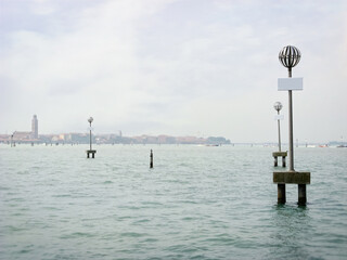 View of the canal in the morning at dawn. Venice, Italy. Charming Venetian waterfront with a view of the bell towers and waterways