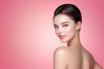 Naklejka premium A portrait of a smiling woman with a smooth complexion against a pink background. (skin care/beauty salon)