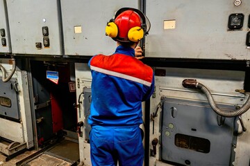 worker operating forklift in warehouse