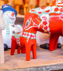 Colorful wooden figurines of typical Dala horse for festive decor