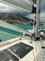 Sailing in calm waters near a picturesque marina surrounded by mountains
