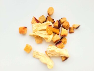 Portion of dried pineapple and sliced plum.