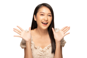 Cheerful woman smiling with hands raised in excitement, wearing beige top