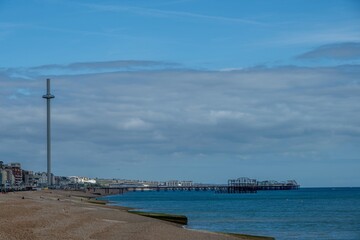 Fototapeta premium view of Brighton Palace Pier and British Airways i360 viewing tower in Brighton East Sussex England