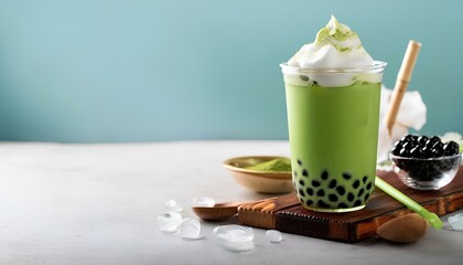 A trending Asian ice drink with a variant of matcha-flavored milk with cream and boba toppings. Copy space image for add text and design. Indonesian food and beverages. Boba drink.