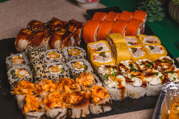 A set of sushi and rolls on the festive table