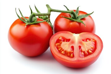 Whole red tomatoes with attached green stems and leaves isolated on a white background