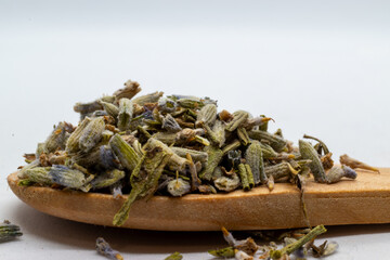 dried lavender on a wooden spoon