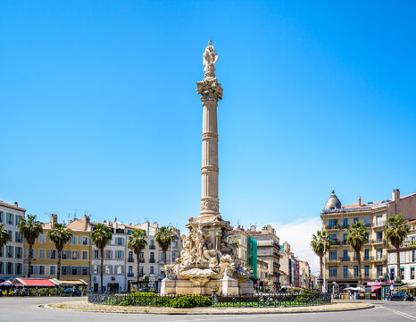 Marseille, France - May 23, 2018: The Cantini fountain by french sculptor Jules Cantini, representing the city on top of a marble column, was built in the center of the place Castellane in 1911.