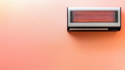 A stylish modern heater on a gradient peach and coral background for a warm aesthetic